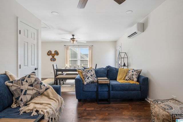 living room with dark hardwood / wood-style floors, a wall unit AC, and ceiling fan