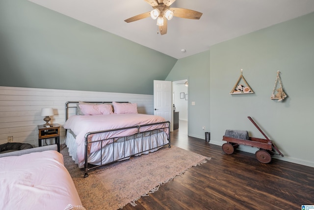 bedroom featuring ceiling fan, dark wood-type flooring, and vaulted ceiling