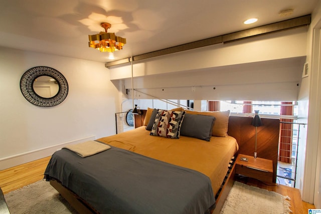 bedroom with wood-type flooring