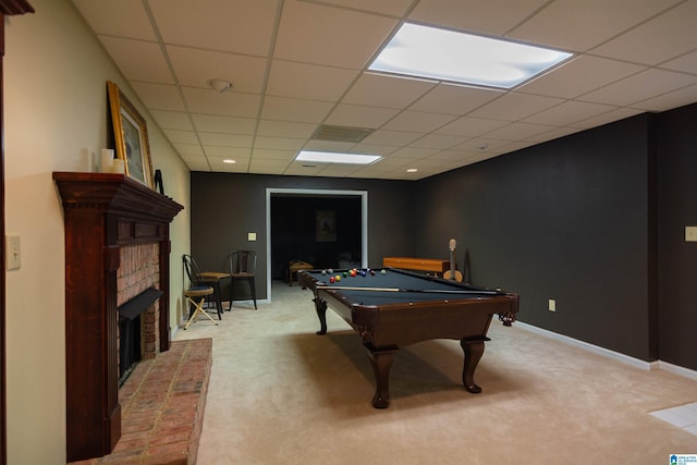 game room featuring light colored carpet, a brick fireplace, a drop ceiling, and billiards