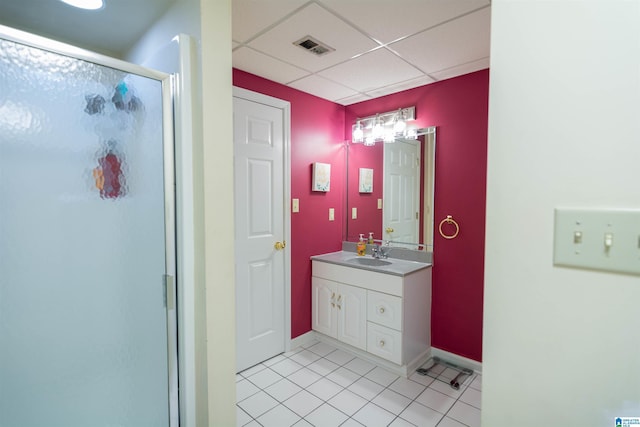 bathroom with vanity, a paneled ceiling, tile patterned floors, and an enclosed shower