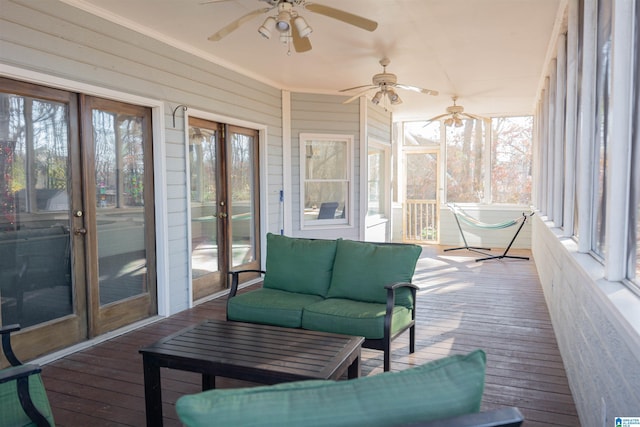 sunroom / solarium with ceiling fan