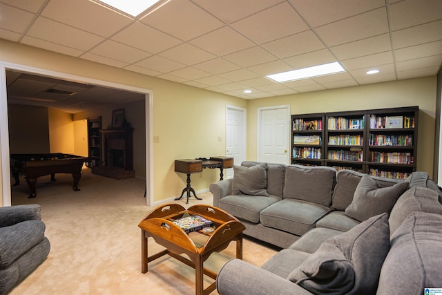 carpeted living room featuring a paneled ceiling and billiards