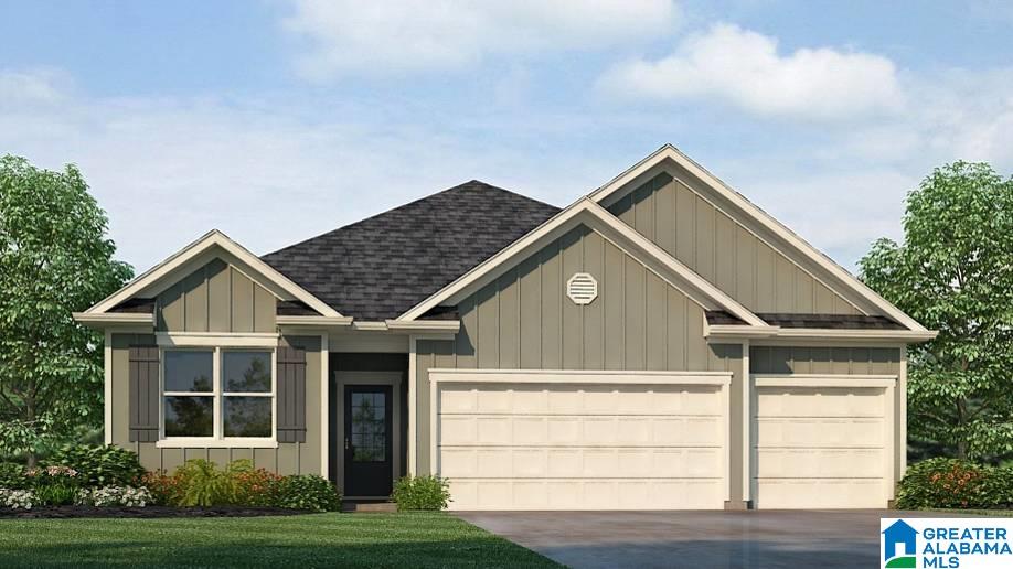 view of front of home featuring a garage and a front lawn