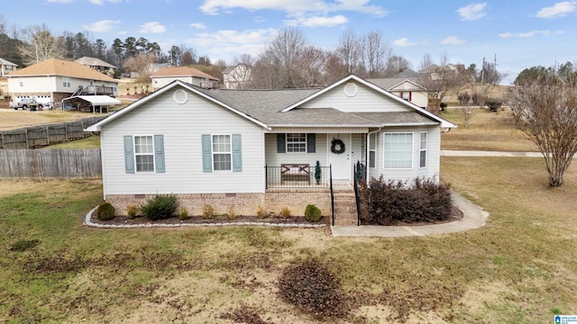 view of front of property with covered porch and a front yard