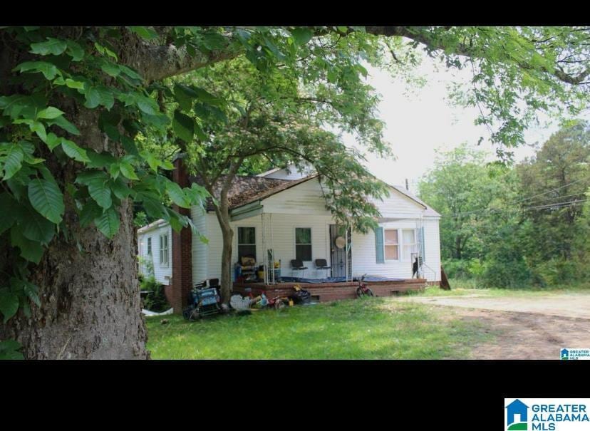 rear view of house with a lawn