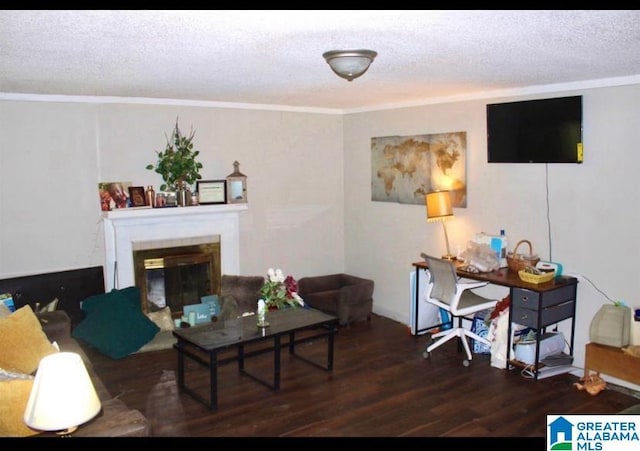 living room with a textured ceiling, crown molding, and dark hardwood / wood-style floors