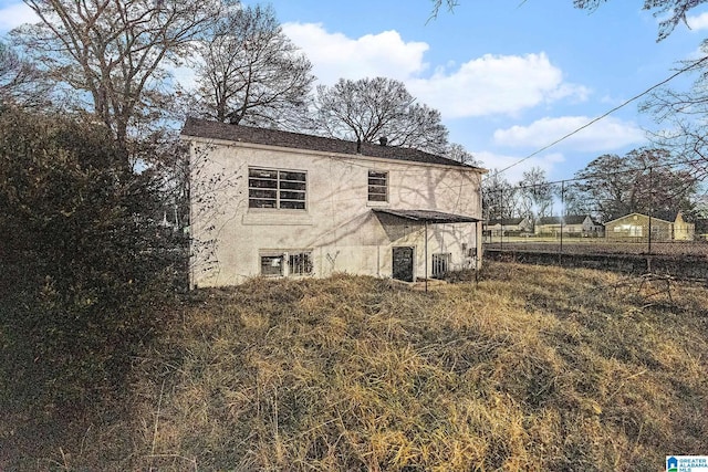 back of house featuring central AC