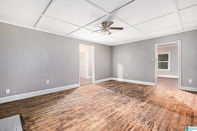 unfurnished room with ceiling fan, coffered ceiling, and hardwood / wood-style flooring