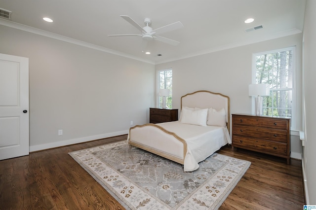 bedroom featuring multiple windows, ceiling fan, crown molding, and dark hardwood / wood-style floors