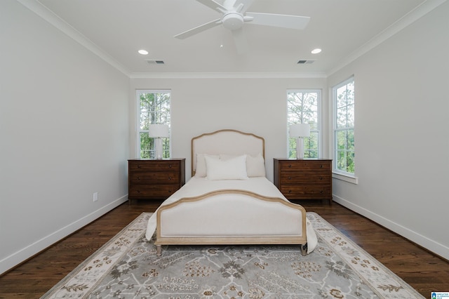 bedroom featuring ceiling fan, wood-type flooring, and ornamental molding