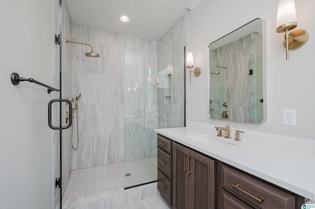 bathroom with vanity and walk in shower