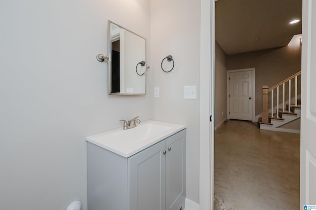 bathroom with vanity and concrete flooring