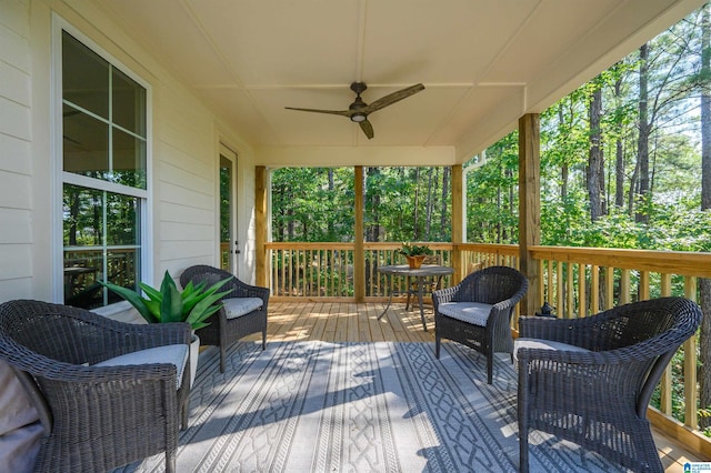 wooden deck featuring ceiling fan