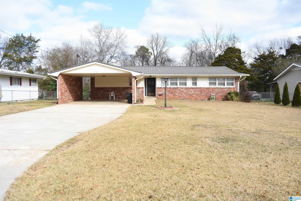 single story home with a front yard and a carport