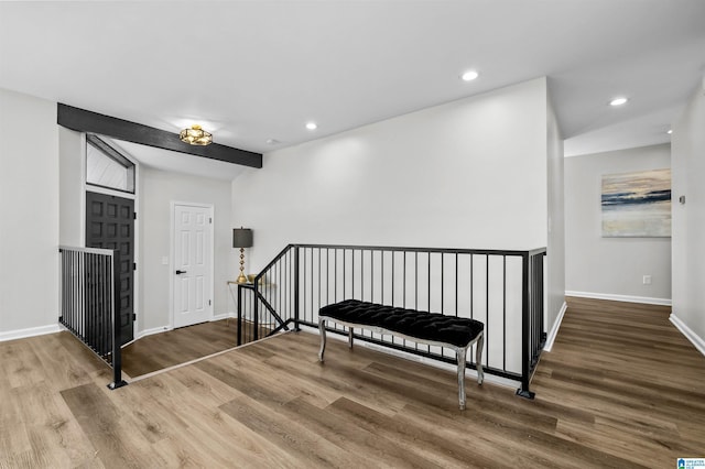 foyer entrance with hardwood / wood-style floors and beamed ceiling