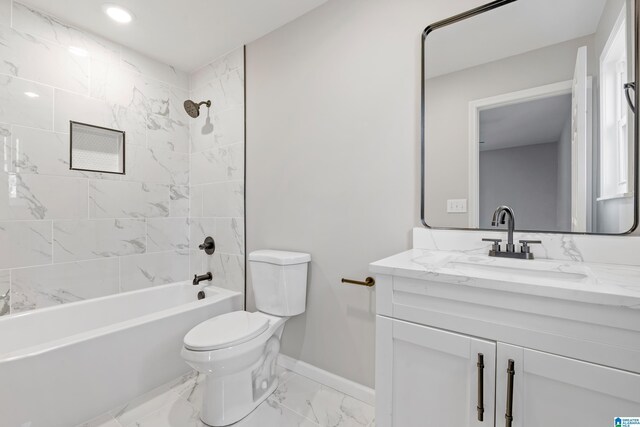 full bathroom with vanity, toilet, and tiled shower / bath combo