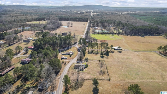 drone / aerial view featuring a mountain view and a rural view