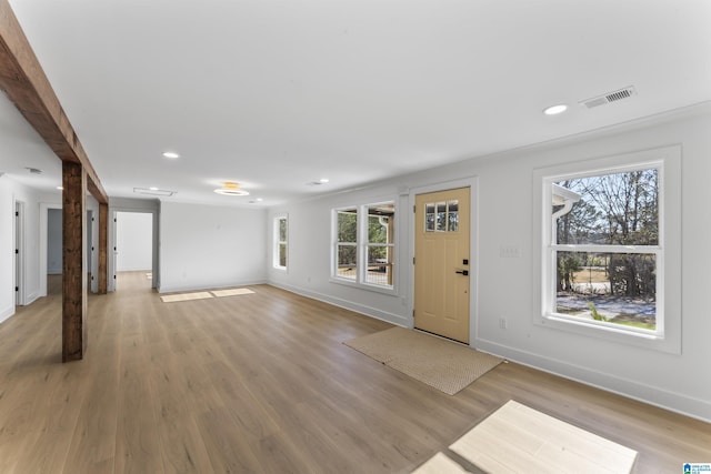 unfurnished living room with light wood-type flooring