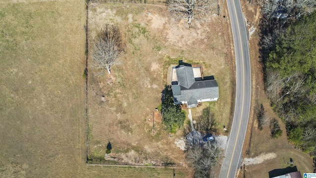 birds eye view of property with a rural view