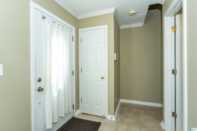 interior space featuring light tile patterned floors and crown molding