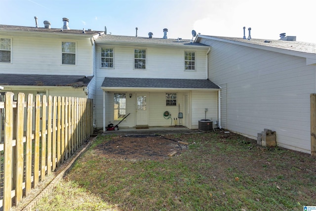 rear view of house featuring a patio area and cooling unit