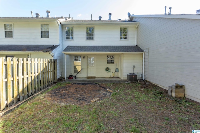 back of property featuring central AC unit and a patio