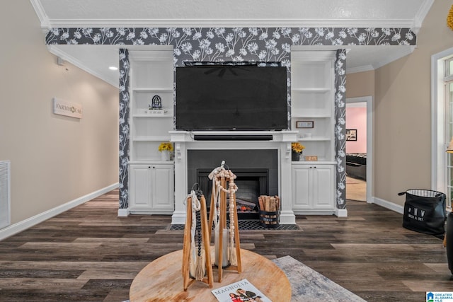 living room with dark hardwood / wood-style flooring, built in features, and ornamental molding