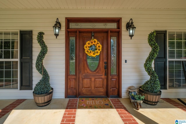 doorway to property with a porch