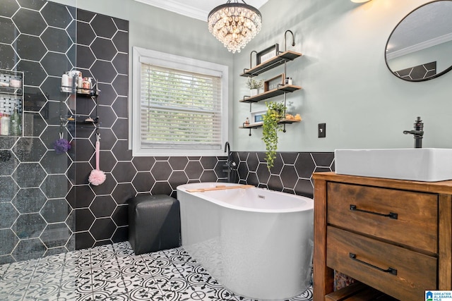 bathroom with vanity, tile patterned flooring, ornamental molding, tile walls, and a chandelier