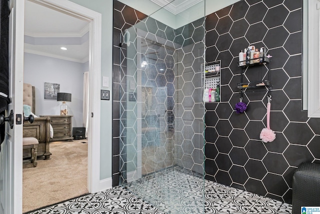 bathroom featuring tile patterned flooring, tiled shower, and crown molding