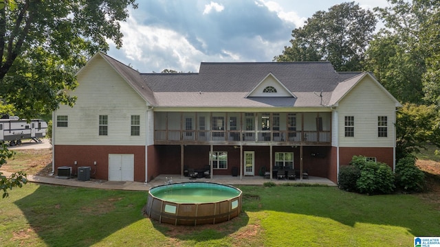 back of house with cooling unit, a patio area, a yard, and a wooden deck