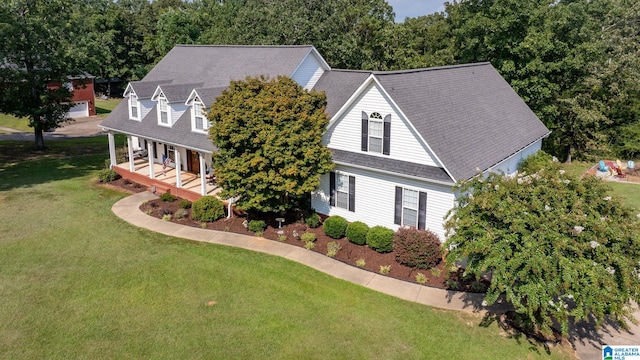 cape cod-style house featuring a front yard and a porch