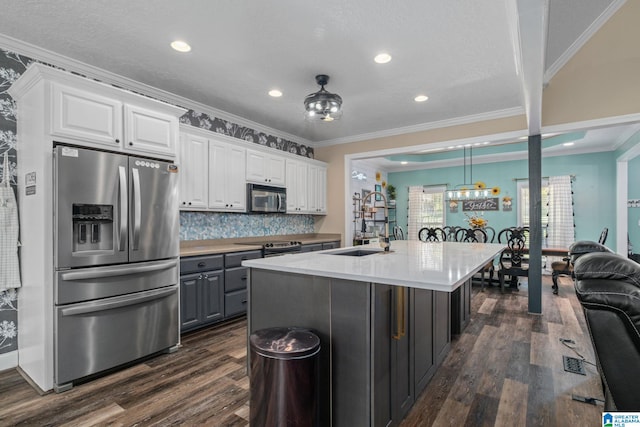 kitchen featuring sink, white cabinets, and appliances with stainless steel finishes