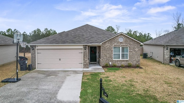 ranch-style house featuring a garage, a front lawn, and cooling unit