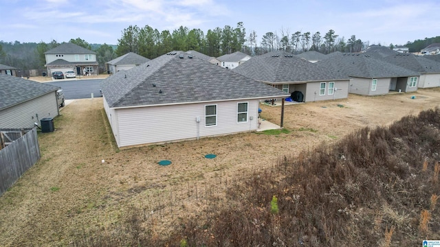 back of property featuring cooling unit