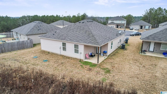 rear view of house featuring a patio and cooling unit