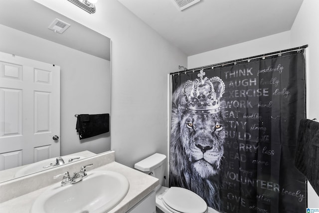 bathroom with a shower with curtain, vanity, and toilet