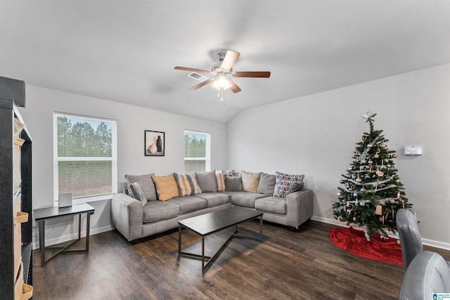 living room featuring dark hardwood / wood-style flooring, vaulted ceiling, and ceiling fan