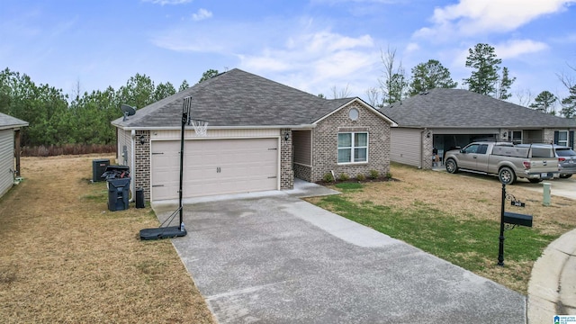 ranch-style house with cooling unit, a front yard, and a garage