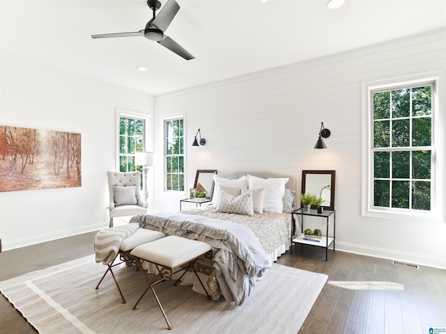 bedroom featuring ceiling fan and dark wood-type flooring