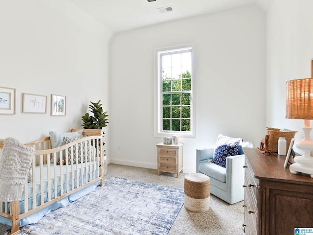 bedroom featuring a crib