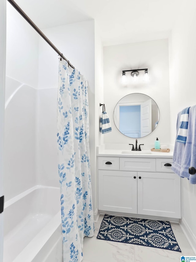 bathroom with shower / tub combo with curtain and vanity