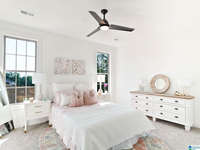 carpeted bedroom featuring ceiling fan