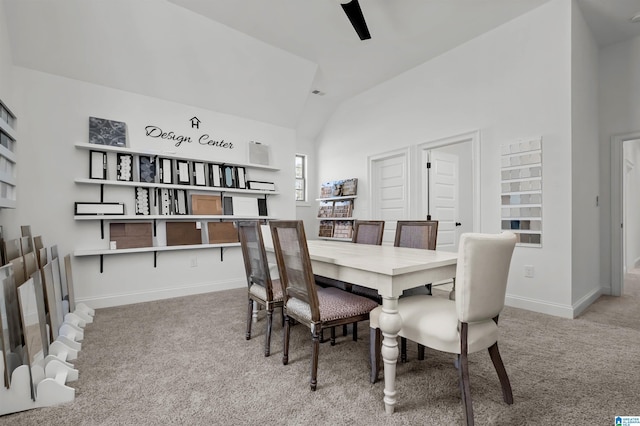 dining room with light carpet and lofted ceiling