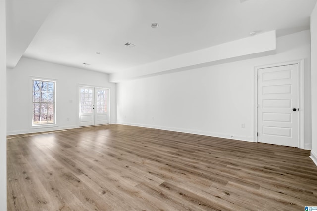 interior space with light wood-type flooring and french doors