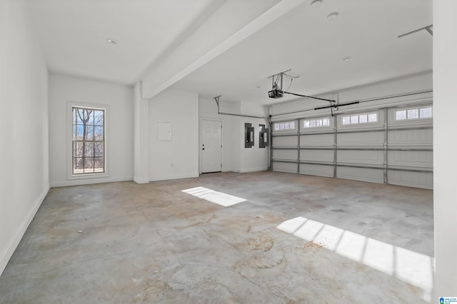 garage with electric panel and a garage door opener