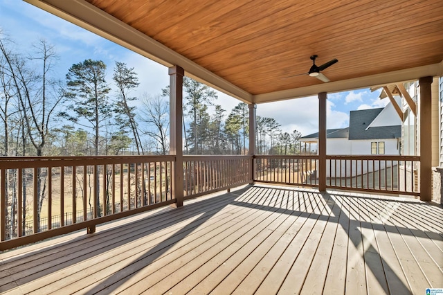 wooden terrace featuring ceiling fan