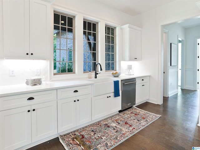 kitchen featuring white cabinets, dark hardwood / wood-style floors, dishwasher, and sink