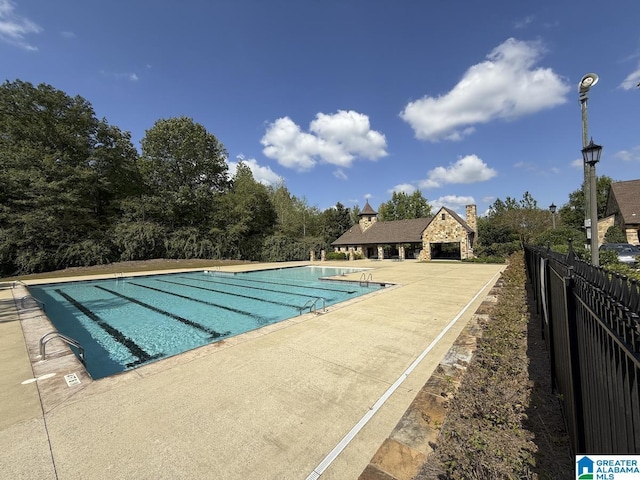 view of swimming pool with a patio